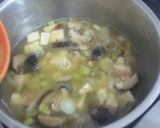 A picture of step 7 of Shitake miso soup with ginger and lime.