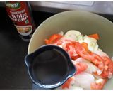 A picture of step 1 of Tomato, Carrot and Cucumber Salad.
