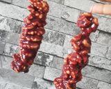 A picture of step 7 of Georgian walnut churchkhela or walnut candy.