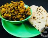 A picture of step 4 of "Achari Aloo Karela".