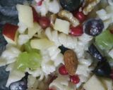 A picture of step 2 of Pasta Fruit Salad with chocolate powder.