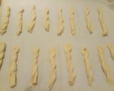 A picture of step 2 of Puffy pastry twists wrapped in parma ham.