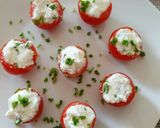 A picture of step 3 of Pomordorini e caprino cherry tomatoes stuffed with goat's cheese.