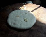 A picture of step 4 of Cheesy kulcha on tawa.