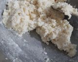 A picture of step 2 of Coconut fritters deep in sugar syrup.