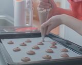 A picture of step 9 of PARISIAN MACARONS (chocolate macarons).