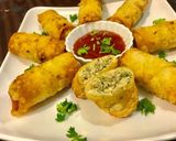 A picture of step 3 of Chicken Roll with white Sauce.