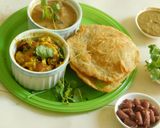 A picture of step 4 of Lunch is served: South Indian Thali with Potato Masala puri, Kidney Beans Koottu, and Green Chutney.