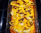 A picture of step 7 of Stuffed Enchilada Shells.