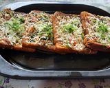 A picture of step 9 of Garlic Brown Bread mix vegetables cheese mini bread pizza.