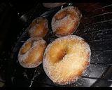 A picture of step 3 of Doughnut coated in sugar.