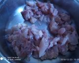 A picture of step 1 of Chicken stuffed squid.