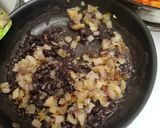A picture of step 3 of Fried black beans.