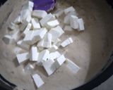 A picture of step 5 of Shahi paneer with white gravy.