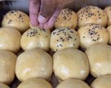 A picture of step 15 of Coconut Sesame Seeds Dinner Rolls.