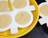 A picture of step 8 of Masala Oats Idly.