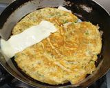 A picture of step 4 of Cheesy Bread Omelette.