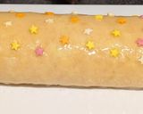 A picture of step 8 of Lemon curd Swiss roll.