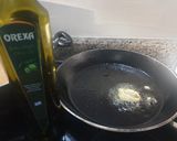 A picture of step 2 of Peppers in a tomato sauce.
