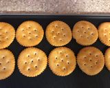 A picture of step 1 of Chocolate covered Ritz crackers filled with white chocolate or peanut butter.