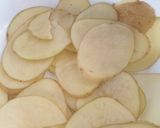 A picture of step 1 of Fried European Sole on a Bed of Potatoes and Garlic with Onion Rings.