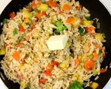 A picture of step 9 of Thai Pineapple Fried Rice.