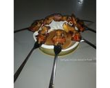 A picture of step 11 of Teriyaki chicken kebab in fork.