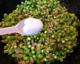 A picture of step 4 of Beans Poriyal stir fry.
