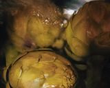 A picture of step 2 of Grilled Artichokes with Garlic, Oil, and Parsley Dressing.