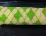 A picture of step 11 of Kiwi swiss roll cake.