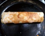 A picture of step 5 of Shezwan masala cheese Dosa roll.