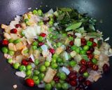A picture of step 3 of Poha with Potatoes Peas and Pomegranate.