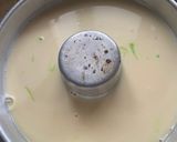 A picture of step 5 of Green Pudding with the hint of coconut powder and Pakola syrup.