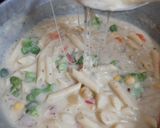 A picture of step 7 of Cheesy and Creamy veggie white sauce penne pasta (with fresh cream, cheese and seasonings).