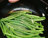A picture of step 5 of Buttery Sautéed French Beans with sesame seeds.