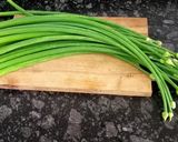 A picture of step 2 of Piyaz Koli (Onion Flower Stalks) Bhela Bhaja.