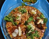 A picture of step 11 of Khichdi dumplings in gravy.