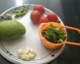 A picture of step 1 of Raw mango tomato and garlic chutney.