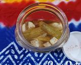 A picture of step 4 of Mukhalal or Arabic Pickled Cucumbers.