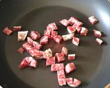 A picture of step 2 of Basque sausage, goats cheese, broad bean and spring onion salad.