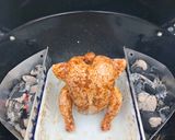 A picture of step 3 of Beer can chicken on the Braai (BBQ) with coal charred corn on the cob.