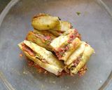 A picture of step 2 of Stuff karela with multigrain chapati.