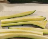 A picture of step 1 of Parmesan zucchini fries with spicy appetizer dipping sauce.