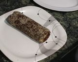 A picture of step 8 of Dates mawa Swiss roll burfi.