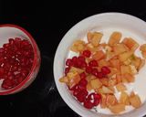 A picture of step 3 of Papaya Anar Raita.