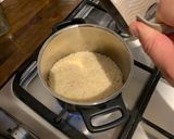 A picture of step 1 of Coconut Milk Rice.