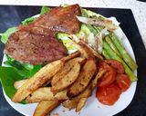 A picture of step 9 of My Peppered Marinated Steak with Onions garlic, Wedge Chips. 😘.