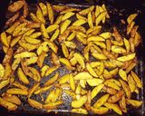 A picture of step 4 of Baked rosemary potatoe wedges.