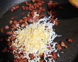 Foto del paso 3 de la receta: Guisantes salteados con jamón y huevo