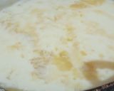 A picture of step 4 of Malai boti pizza with white sauce.